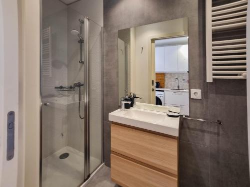 a bathroom with a sink and a shower at SAM - Studio in the city center in Viana do Castelo