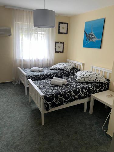 Ένα ή περισσότερα κρεβάτια σε δωμάτιο στο Appartement C
