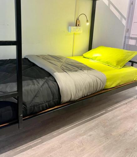 a bedroom with two beds on a metal bunk bed at Himtrek Stays,Mcleodganj in McLeod Ganj