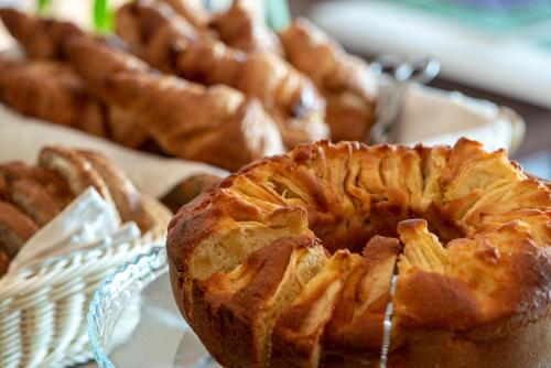 a plate with a pie on a table with other pastries at Altarocca Wine Resort Adults Only in Orvieto