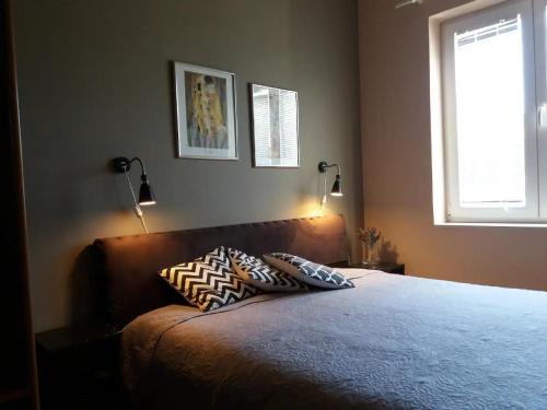 Postel nebo postele na pokoji v ubytování Apartments Villa Dona
