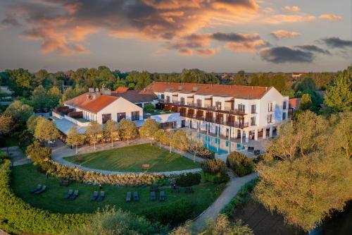 an aerial view of a mansion with a large yard at Tisza Balneum Hotel in Tiszafüred