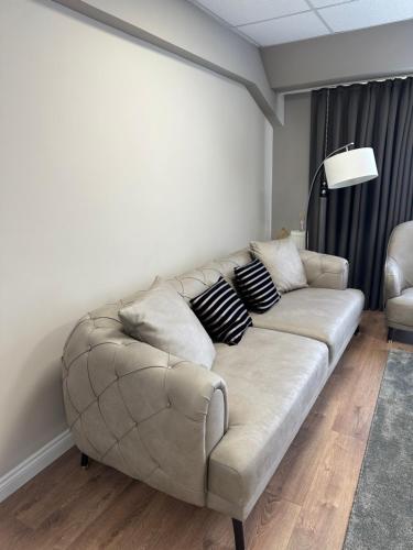 a living room with a couch in a room at Apartaments Filipopolis in Plovdiv