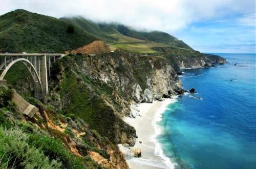 a bridge over a beach next to the ocean at Palo Alto Quiet 1 Bedroom Stanford University in Palo Alto
