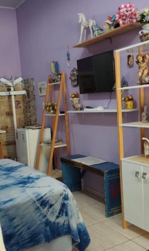 Ένα ή περισσότερα κρεβάτια σε δωμάτιο στο Pernoites no Ateliê La Rosa II