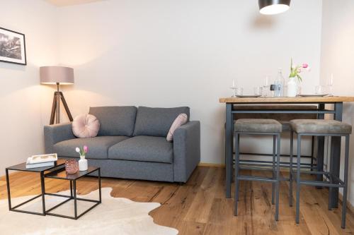 a living room with a couch and a table at Going Living in Going