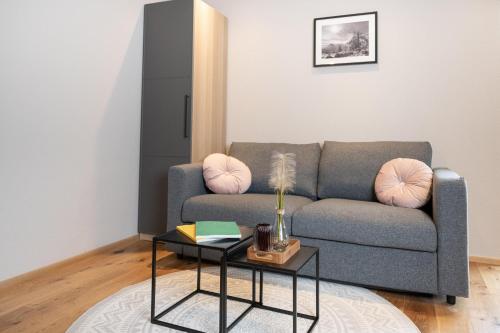 a living room with a couch and a table at Going Living in Going