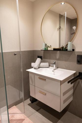 a bathroom with a sink and a mirror at Going Living in Going