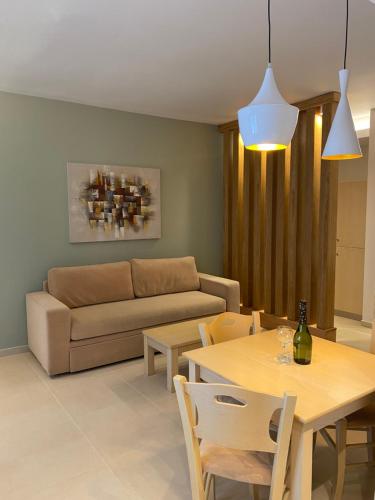 a living room with a couch and a table at Elena Village Hotel & Suites in Kalymnos