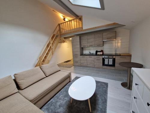 a living room with a couch and a table at Sanner Valley Home in Boltigen