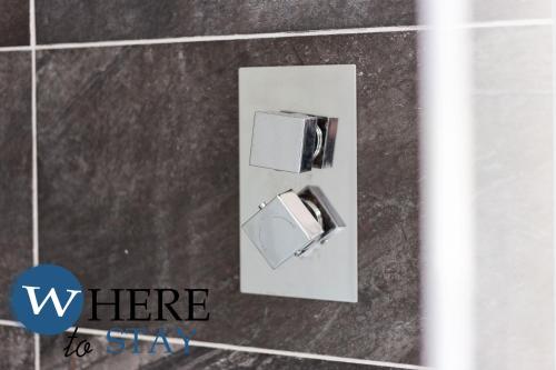an overhead view of a toilet in a bathroom at Elegant 4bed House-FREE parking in Barrow in Furness
