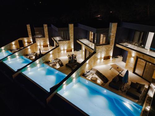 an aerial view of a hotel with a swimming pool at Villa Kastos in Paleros