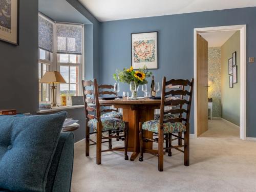 a dining room with a table and chairs at The William Morris Lodge in the centre of Ludlow - Pass the Keys in Ludlow