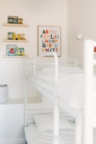 a room with white walls and white pillows at Fox Lane - Prince Edward County Farmhouse in Picton