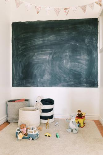 a classroom with a blackboard and toys on the floor at Fox Lane - Prince Edward County Farmhouse in Picton