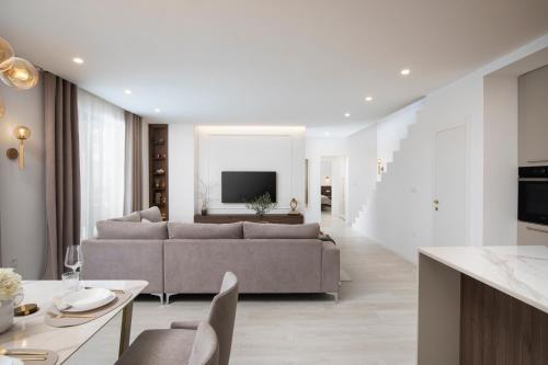 a living room with a couch and a table at Villa Artis in Pula