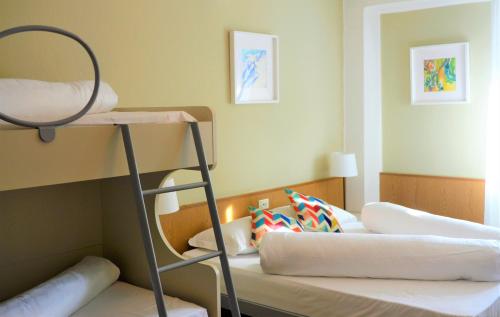 a bunk bed room with two bunk beds at Park Hotel Sancelso in Bellamonte
