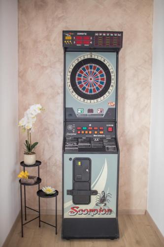 a video game machine with a dartboard on it at Beautiful Holiday Home "Villa Relax Oasis" in Trogir