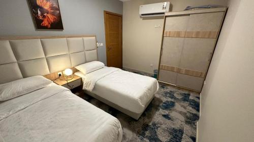 Een bed of bedden in een kamer bij مكة ابراج التلال