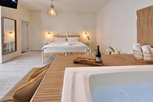 a bedroom with a bed and a tub in a room at הקצה- The Edge in Sifsufa
