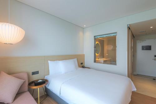 Una cama o camas en una habitación de Hotel Marine view