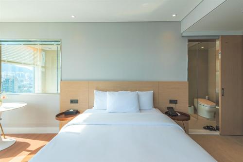 Una cama o camas en una habitación de Hotel Marine view