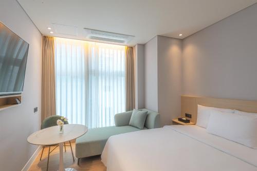Una cama o camas en una habitación de Hotel Marine view