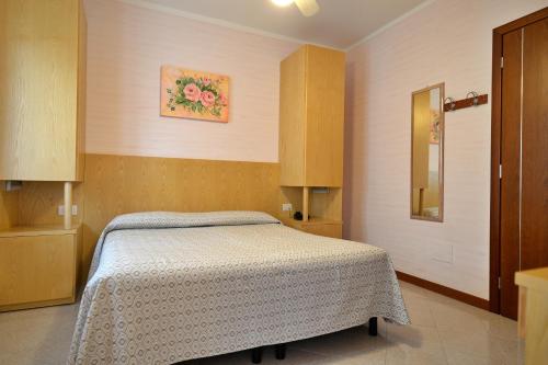 Letto o letti in una camera di Hotel Fiordaliso