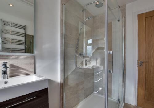 a bathroom with a shower and a sink at Watercrag in Gunnerside