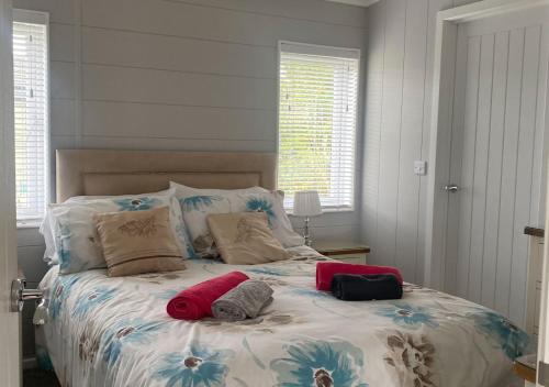 a bedroom with a bed with two pillows on it at Walkers Retreat in Routh