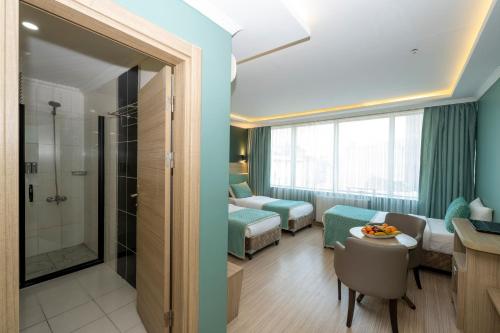 Ένα ή περισσότερα κρεβάτια σε δωμάτιο στο The Hotel Ottoman City Istanbul
