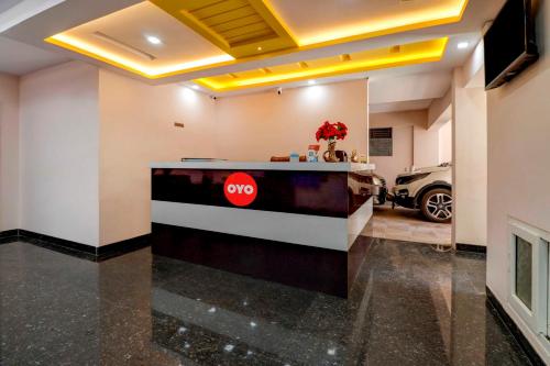 a pay station in a room with a car parked at Hotel Royal Comfort Near Cubbon Park in Bangalore