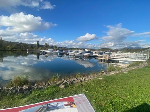 a view of a river with boats in the water at Au Château Saint Blaise in Virignin