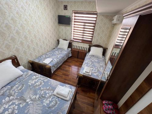Postel nebo postele na pokoji v ubytování Khamza Hostel