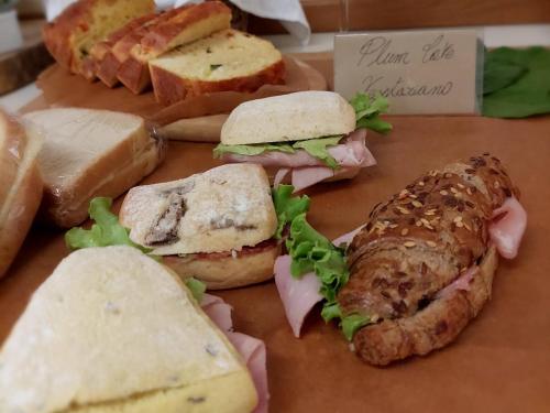 a group of sandwiches and bread on a table at Hotel Miramonti in Schio