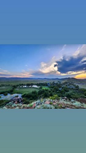 two pictures of a city with a sky at Big Sky Ranch in Colesberg