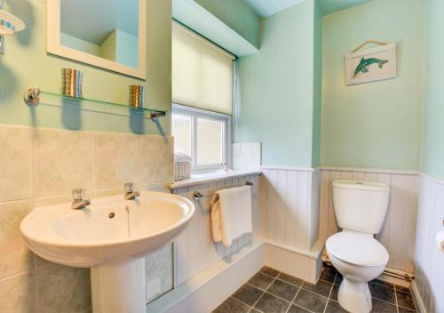 a bathroom with a sink and a toilet at The Shippon in Askrigg in Askrigg