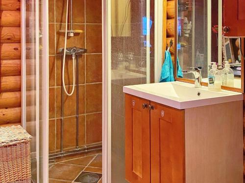 a bathroom with a shower and a sink at Holiday home Gratangen II in Gratangen