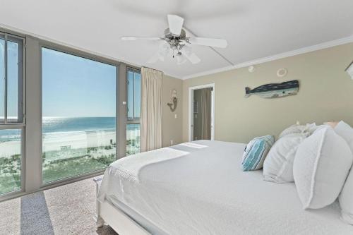 a bedroom with a bed with a view of the ocean at Perdido Towers East 403 in Perdido Key