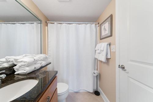 a bathroom with a sink and a toilet and a shower at Perdido Towers East 403 in Perdido Key