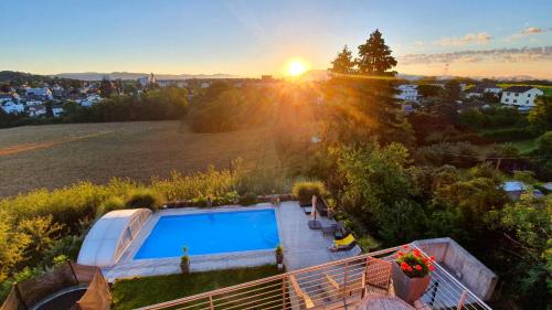 an aerial view of a villa with a swimming pool at Mountains and Lakes - Villa Gaumberg in Linz