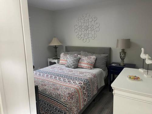 a bedroom with a bed with pillows on it at Eagle's Nest Cottage - Lake Anna Waterfront in Bumpass