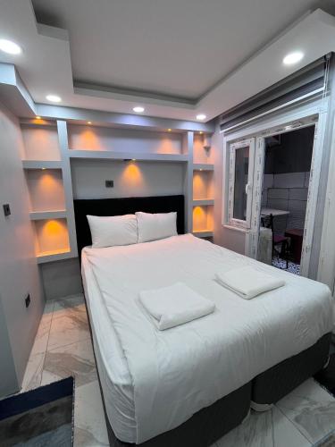 a bedroom with a large bed with two white pillows at LİFE APART- basement in Istanbul