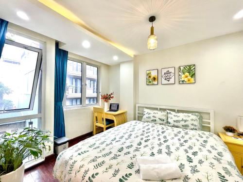 Una cama o camas en una habitación de Vitamin Home Hoè Nhai