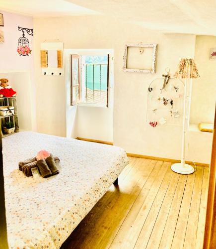 a bedroom with a bed and a window at Casa Angiolina - Holidays in Morcote
