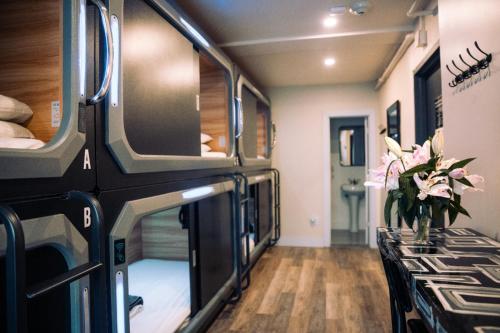 an rv with a table and flowers in a room at KAMA CENTRAL PARK in New York