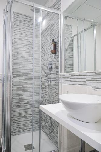 a bathroom with a sink and a shower at Hotel Terrazza Magenta in Rome