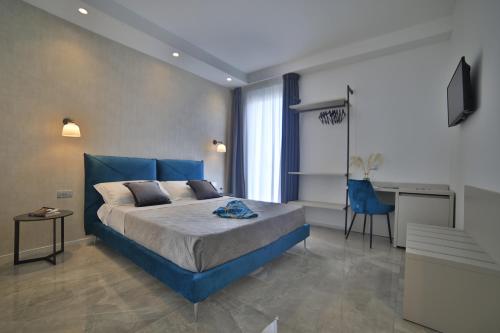 Ένα ή περισσότερα κρεβάτια σε δωμάτιο στο Calaluna Rooms