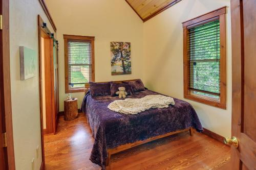 a bedroom with a bed with a teddy bear on it at Downtown Bonners Ferry Home with Covered Porch! in Bonners Ferry