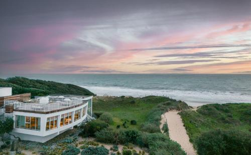 an aerial view of a house on the beach at Hôtel & Spa Le Grand Large in Dolus-d'Oléron